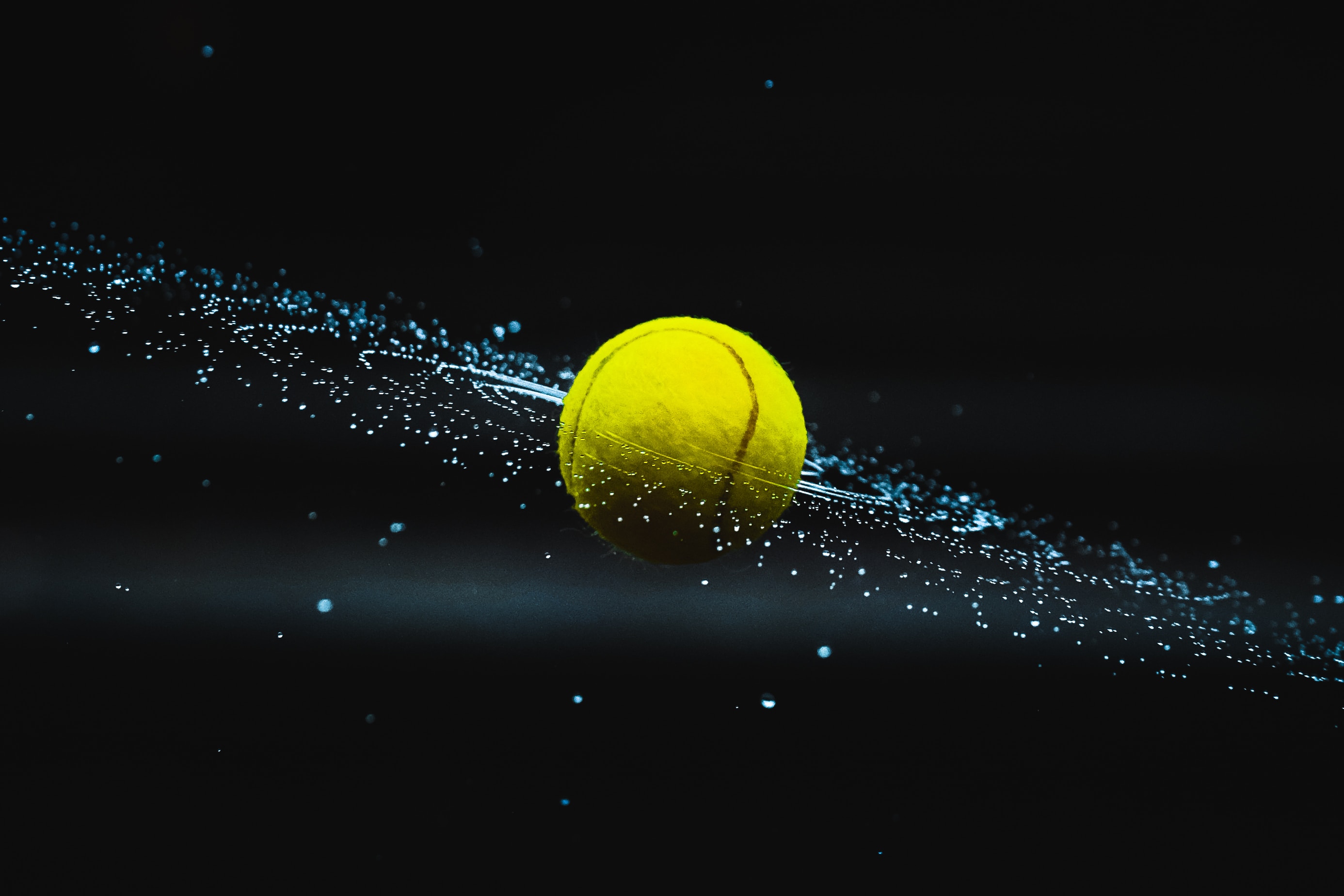 a spinning tennis ball stopped in time